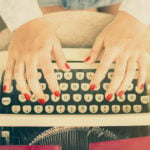 Woman Typing On A Typewriter