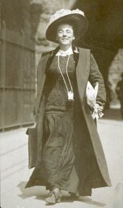 Jessie Tarbox Beals walking a city street