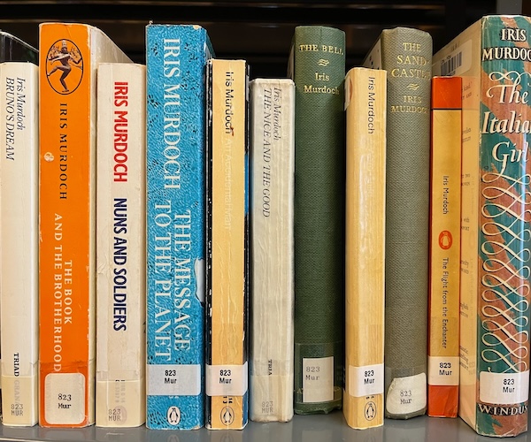Iris Murdoch books on a library shelf