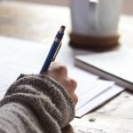 Young woman writing